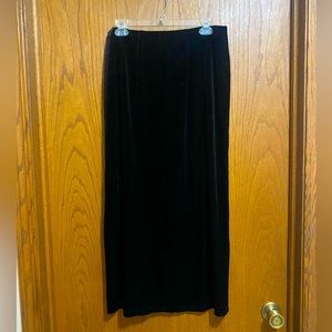 Long elegant black velvet skirt. Dress barn size large. Slit in back.